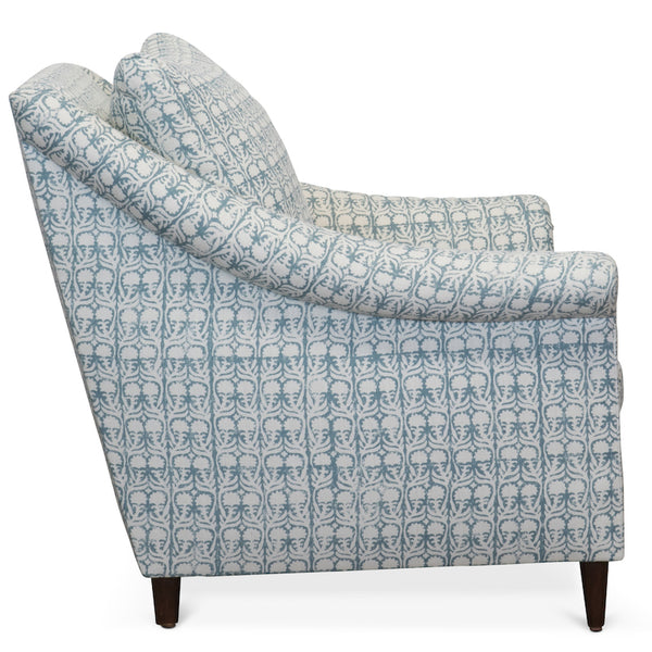 The Melrose Armchair, designed by Hollywood at Home founder Peter Dunham, is inviting and comfortable, featuring loose cushions, a turned arm, and tapered legs.