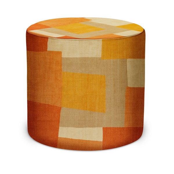 Round indoor pouf with orange, yellow, and beige patchwork fabric cover.