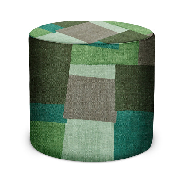 Round indoor pouf with multicolor collage fabric in green and gray blocks