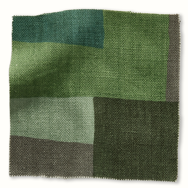 Green and gray patchwork collage pillow cover with fringed edges