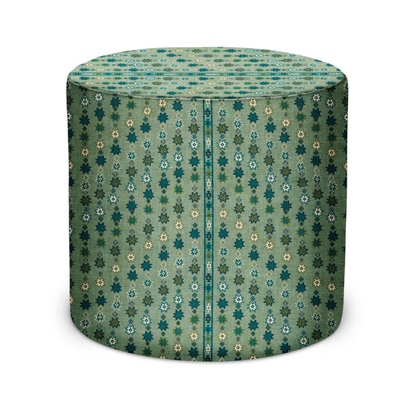 Indoor pouf with teal, green and beige geometric patterned fabric, rounded cylindrical shape