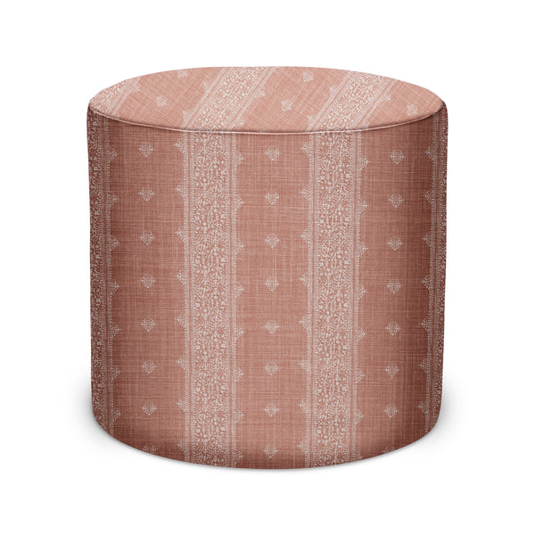 Terracotta fabric indoor pouf with light geometric pattern on sides and top
