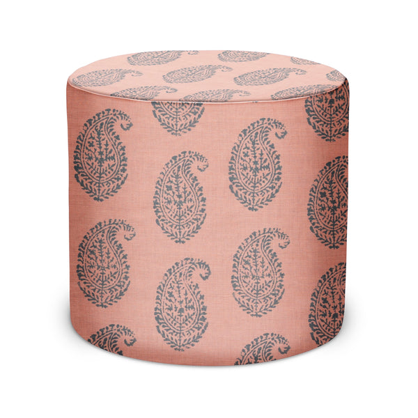 Indoor pouf ottoman with pink-and-blue paisley fabric, round cylinder top
