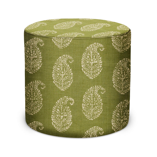 Round indoor pouf upholstered in green fabric with white paisley pattern