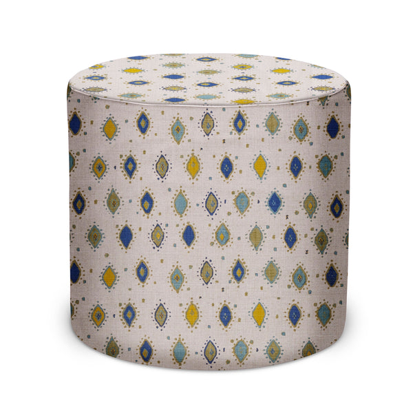 Indoor pouf with round top in natural fabric, indigo, olive, blue, and gold pattern