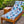 Indoor/outdoor Formosa chaise lounge with blue geometric cushion set and wood base