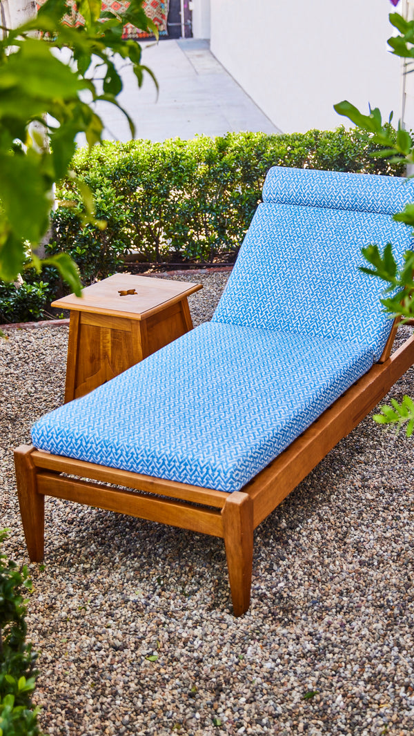 Indoor/outdoor Formosa chaise lounge with blue textured cushion and wood frame