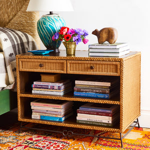Wicker bedside cabinet with open shelves and rattan drawer, visible front view