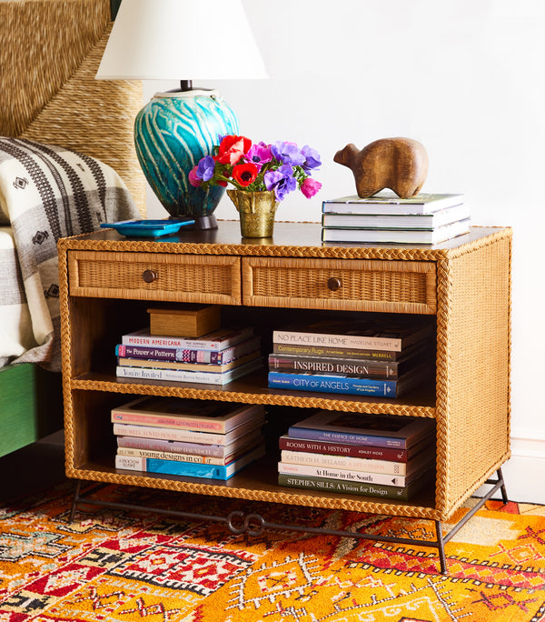 Wicker bedside cabinet with open shelves and rattan drawer, visible front view