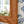 Rectangular wicker mirror with braided brown frame and woven corner detail