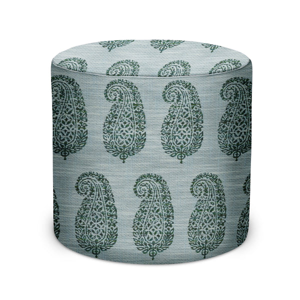 Indoor/outdoor pouf with green paisley pattern on blue fabric, cylindrical top.
