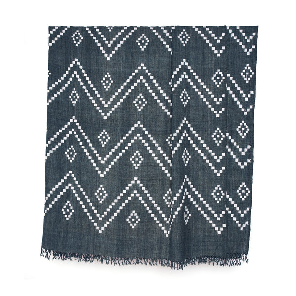 Charcoal bedcover with geometric zigzag motifs and tassel fringe border