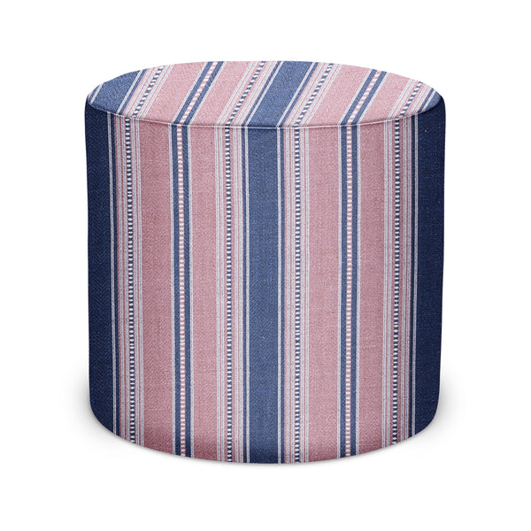 Indoor pouf ottoman with blue and pink striped fabric, round cylindrical top