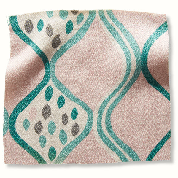 Pink and green patterned pillow cover with abstract wave and paw motifs