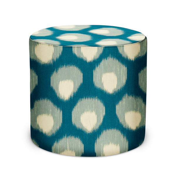 Blue indoor pouf with circular top and white ikat-style dot pattern