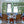 Indoor/outdoor rush sofa with blue seat and back cushions