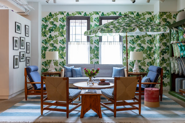 Indoor/outdoor rush sofa with blue seat and back cushions