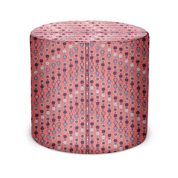 Indoor pouf with round padded top and pink blue black geometric fabric