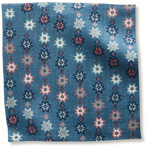 Blue decorative pillow cover with multicolor starburst pattern