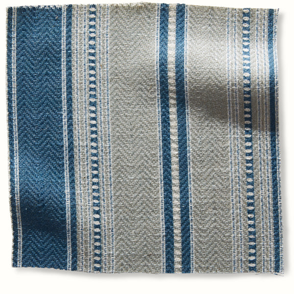 Woven dhurrie rug with vertical blue and light gray stripe pattern, textured weave