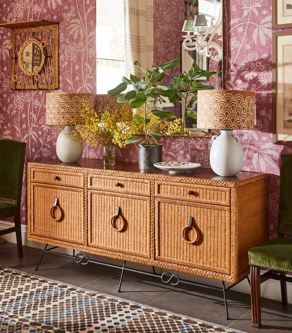 Wicker credenza cabinet with rattan door fronts, drawers, and metal legs