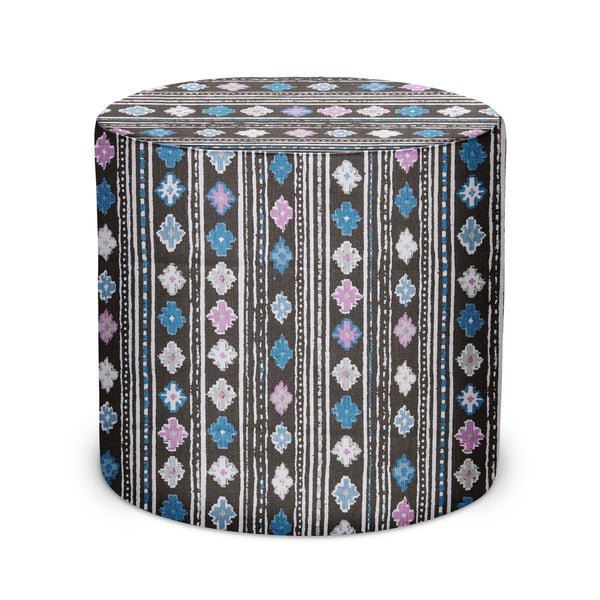 Round indoor pouf with blue, pink, and white floral stripe fabric cover