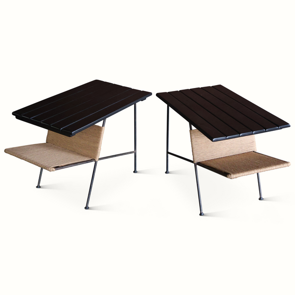 Pair of slat iron side tables with dark slatted tops and beige woven lower shelves