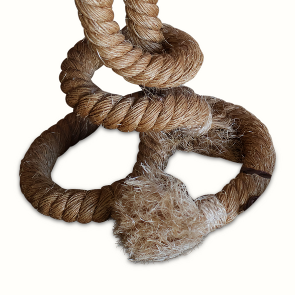 Close-up of rope loops on a table lamp base with frayed fibers