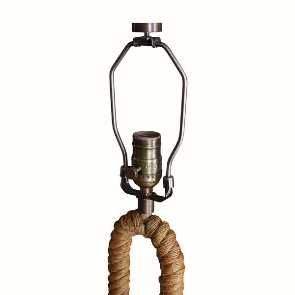Rope table lamp with metal lantern frame and coiled rope base