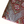 Lexington ottoman corner close-up of textured rug weave in gray, red, purple