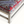 Lexington ottoman corner with rug-pattern upholstery and sturdy light wood base