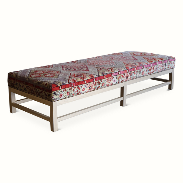 Lexington ottoman with vintage Persian rug-pattern top and dark wood legs
