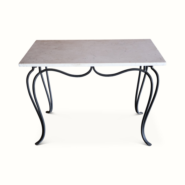 Marble-top wrought iron table with scalloped apron and curved black legs
