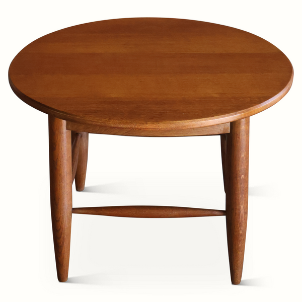 Dark brown round-top solid wood side table with four tapered legs and lower shelf bar