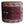 Round kilim pouf with multicolor geometric pattern and tan leather-look top