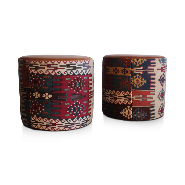 Geometric kilim pouf with multicolor patchwork panels and tan leather-look top