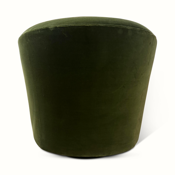 Green velvet swivel chair back view with tall curved backrest and padded seat.