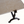 Limestone tabletop corner with dark wrought iron leg and arched foot support