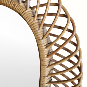 Bamboo mirror frame close-up: woven lattice around an oval edge
