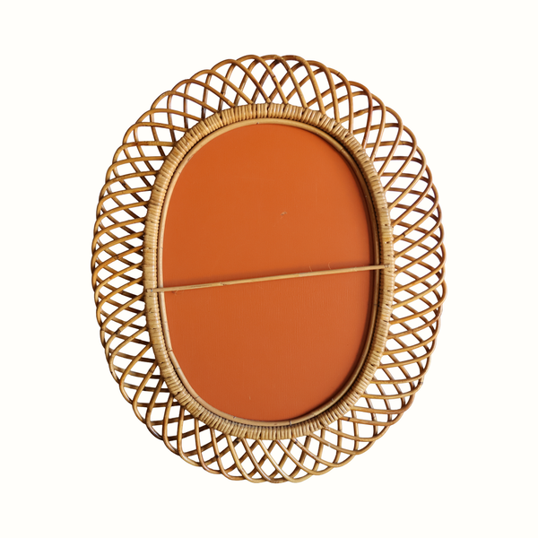 Rattan bamboo oval mirror with woven arched frame and orange back panel