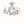White gesso-plaster iron chandelier with scrolling arms and five candle-style lights
