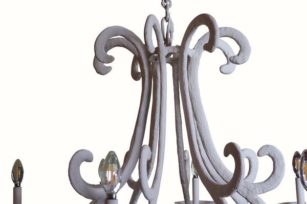 Close-up white gesso-plaster iron chandelier top with chain and curved scroll arms