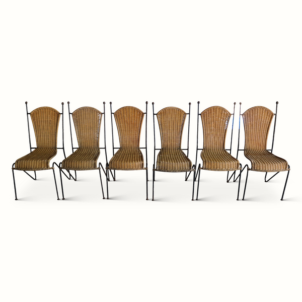 Set of six wicker chairs with dark iron frames, arched backs and woven seats