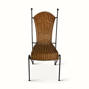 Wicker chair with dark iron frame, arched back and woven seat