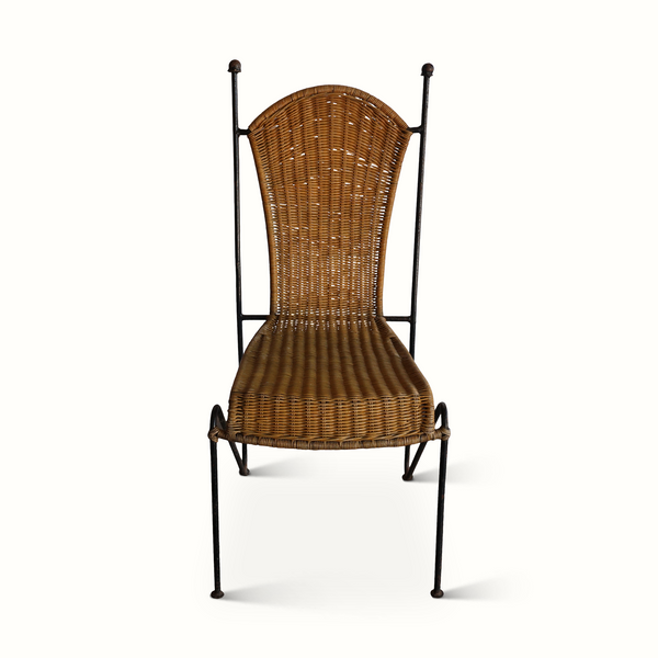 Wicker chair with dark iron frame, arched back and woven seat