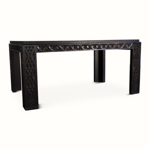 Antique Moroccan table, side view, dark carved apron with repeating diamond texture