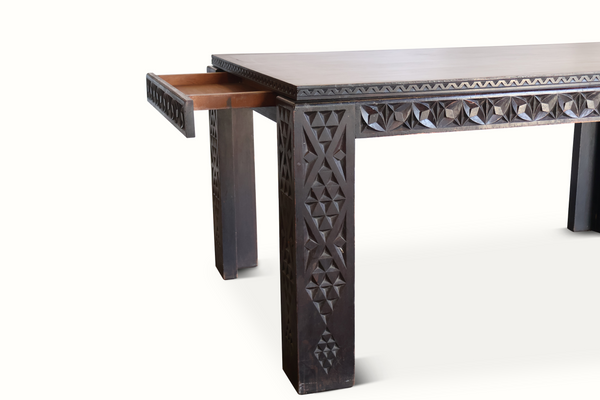 Antique Moroccan table angled view with carved posts and open underside
