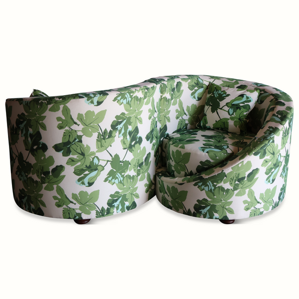 Loveseat sofa with fig-leaf print upholstery, rounded arms and seat cushions