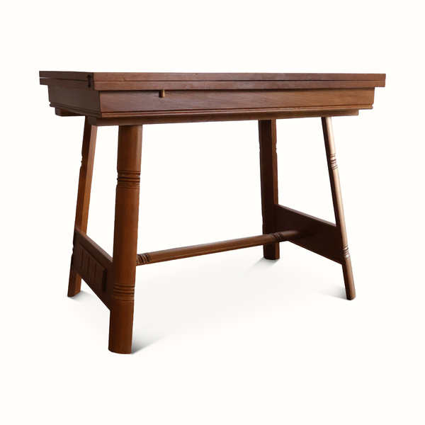 Oak flip-top game table side view with turn-pedestal legs and open flip-top frame.