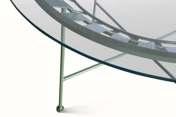 Green slatted patio table edge with curved frame and cross support bars